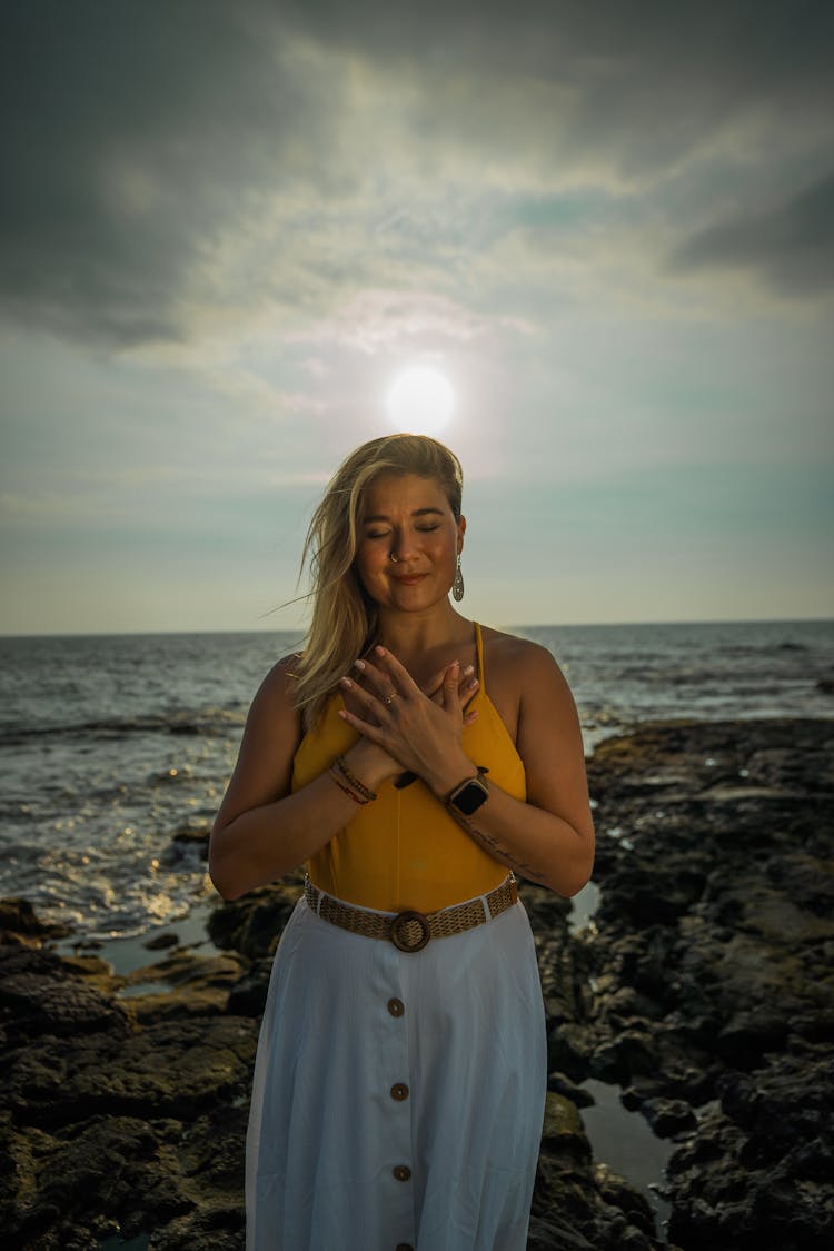 Calm Woman Meditating On Beach