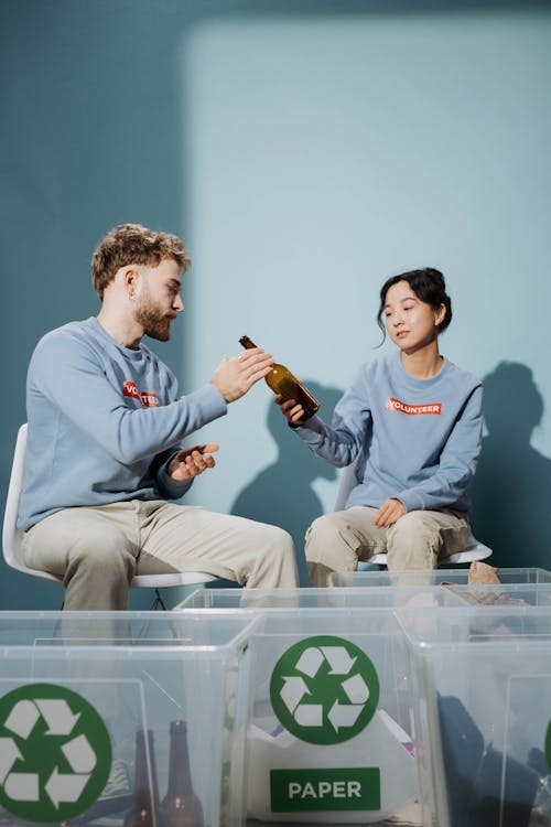 Man and Woman Sorting Garbage