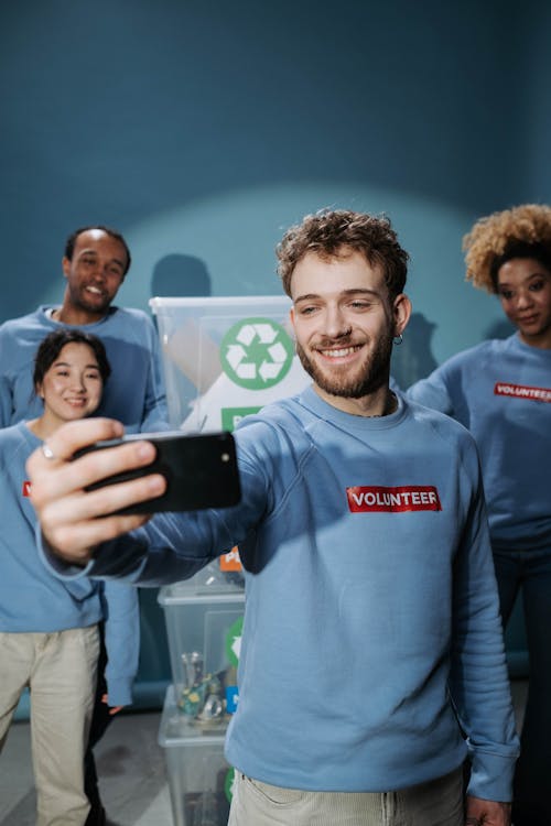 Man in Blue Sweater Doing Selfie