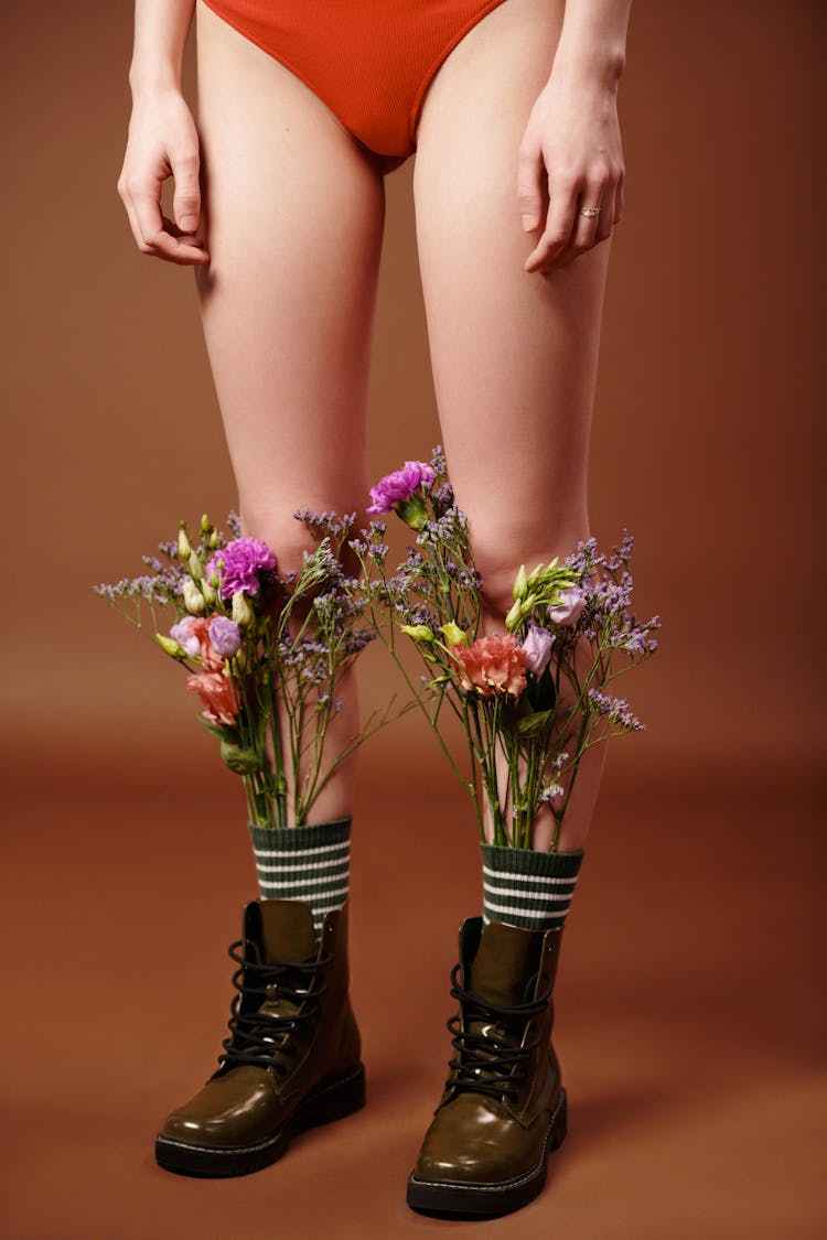 Flowers Inserted On A Woman's Socks