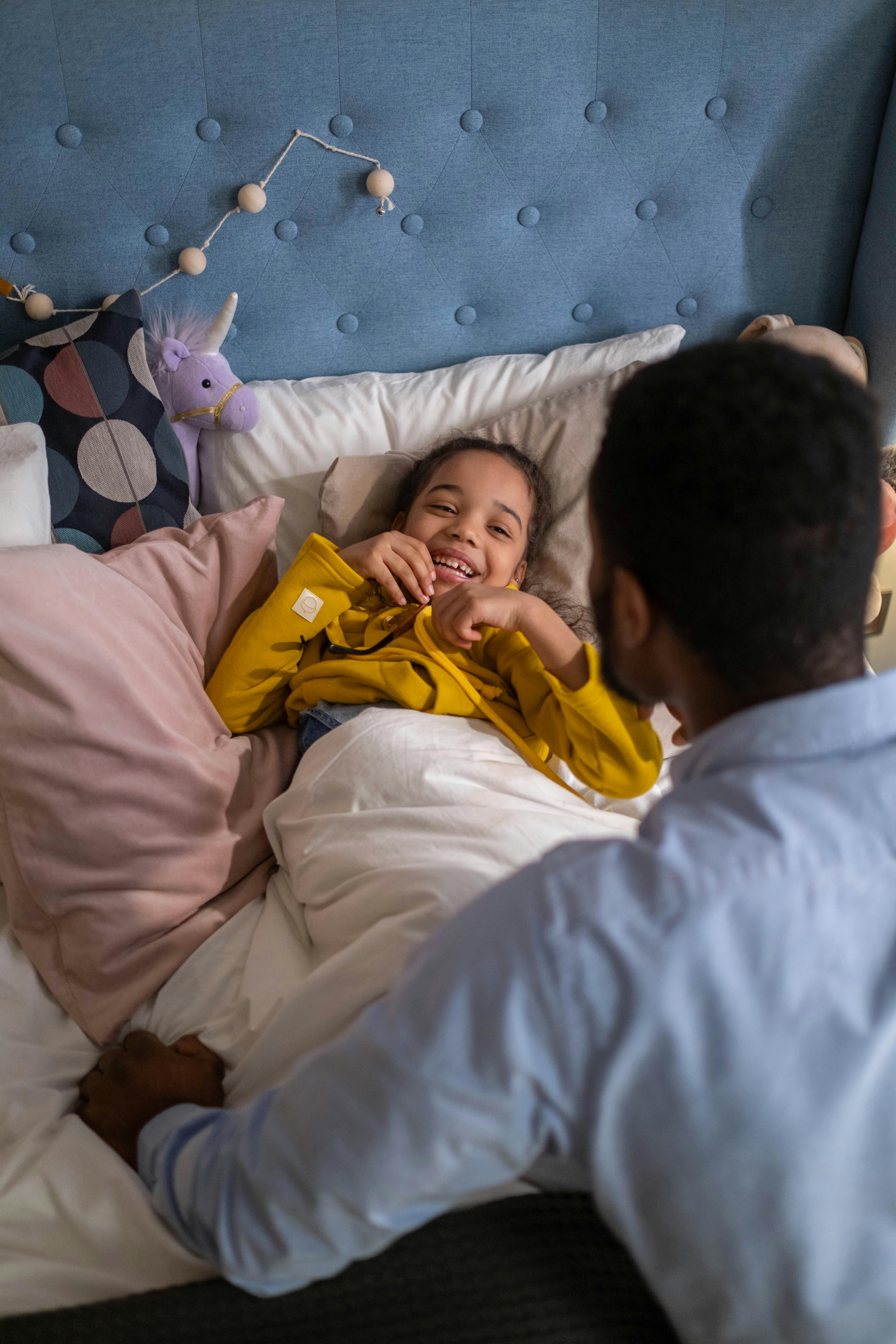 girl lying down on the bed smiling