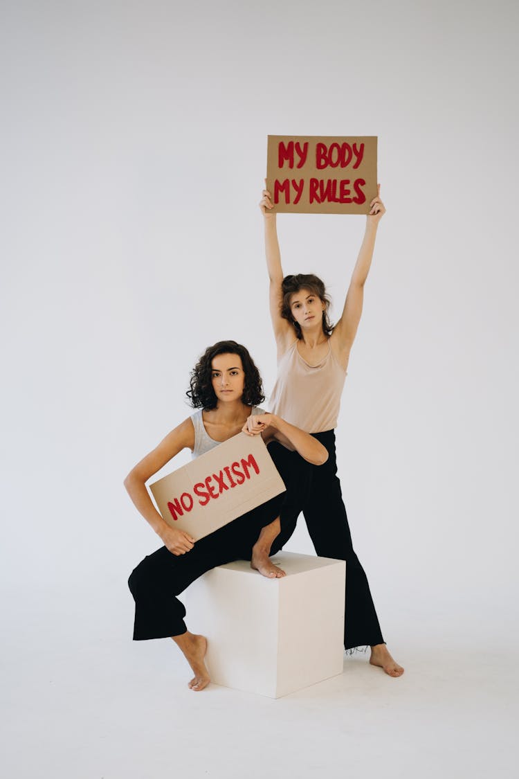 Women Holding Placards In White Background 