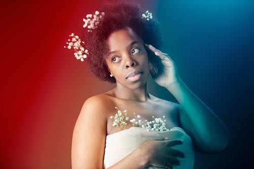 Woman Posing with Flowers on Her Hair