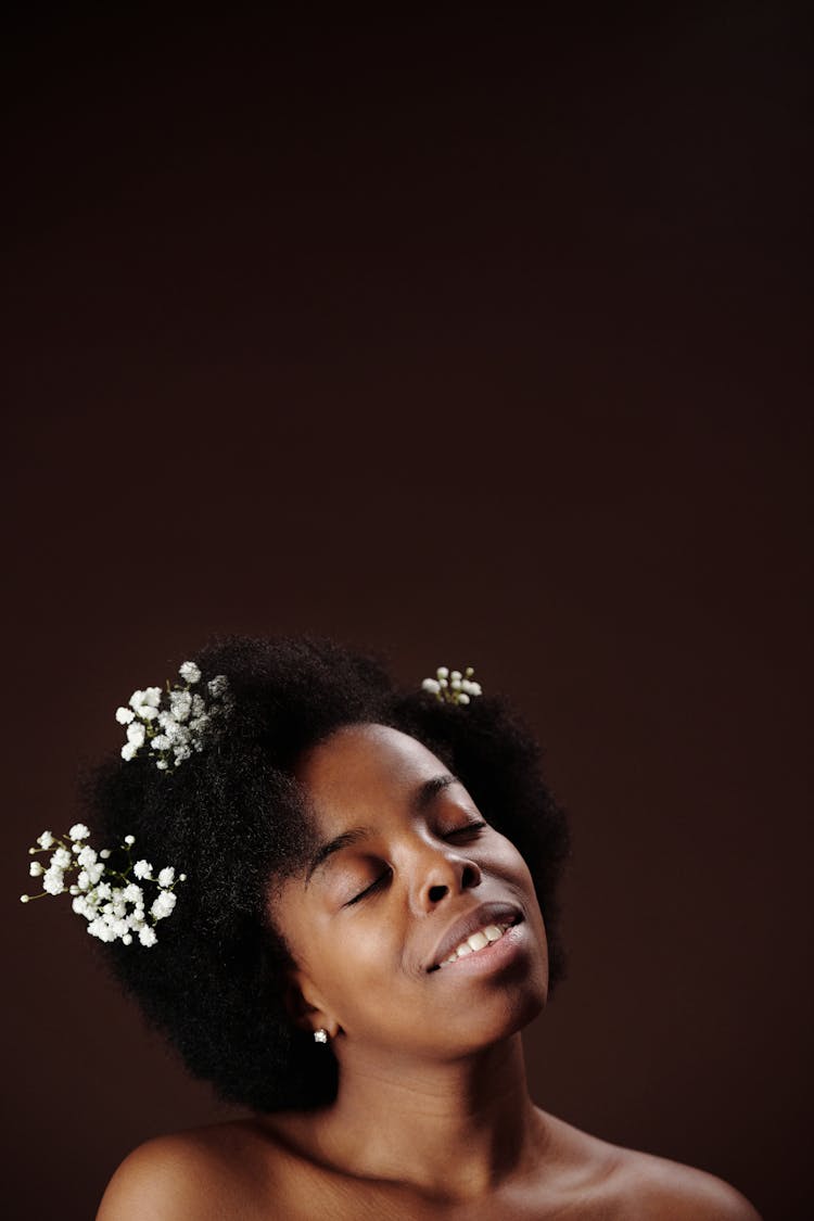 Woman With White Flowers On Hair