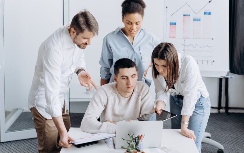 Professional team working together at a desk