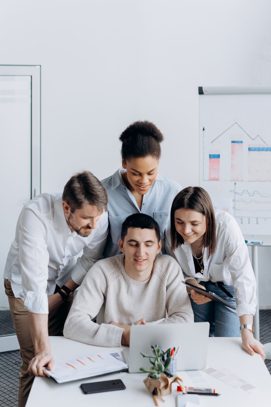 Professional team discussing digital strategy in a bright office