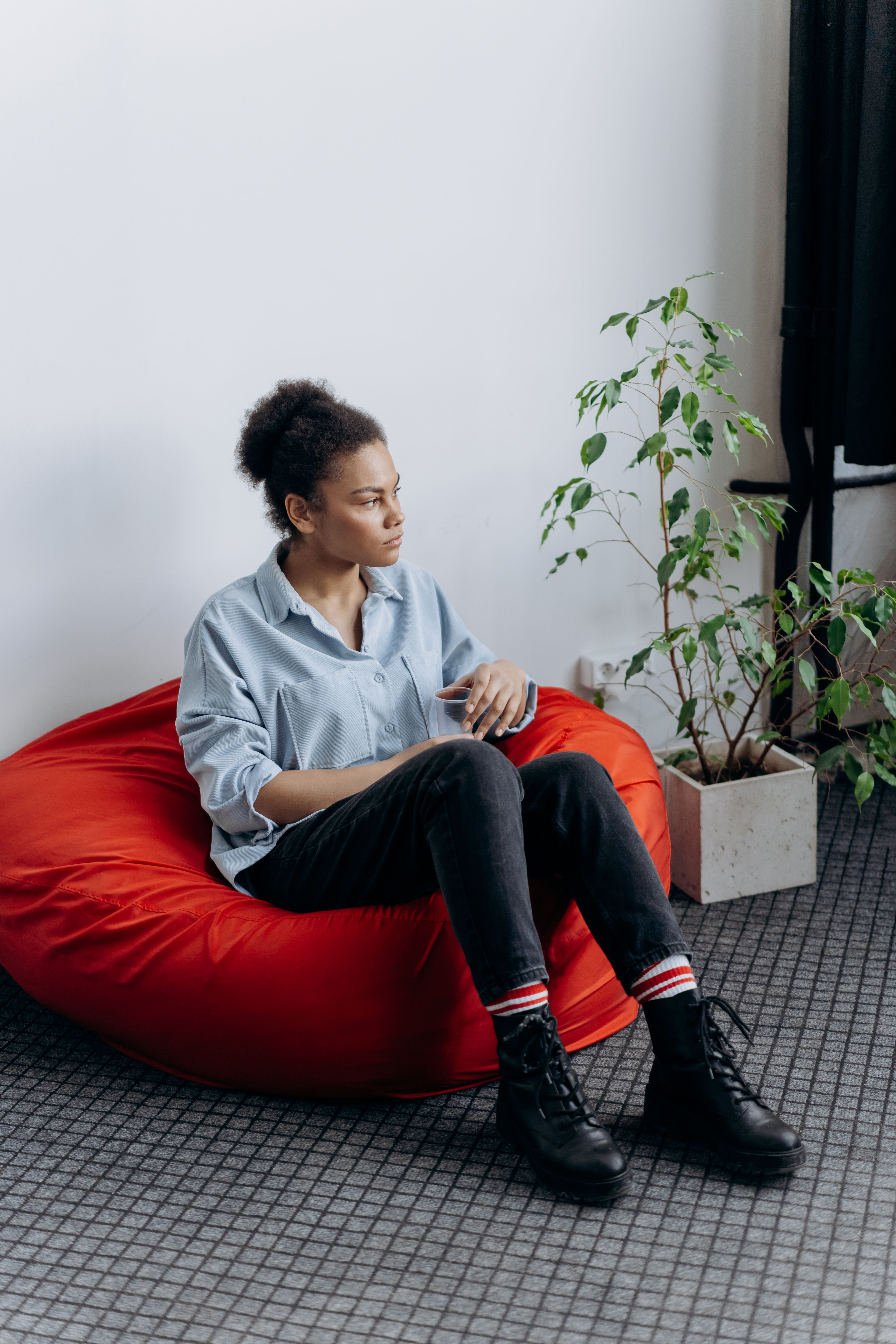 Woman Sitting on a Bean Bag Chair · Free Stock Photo