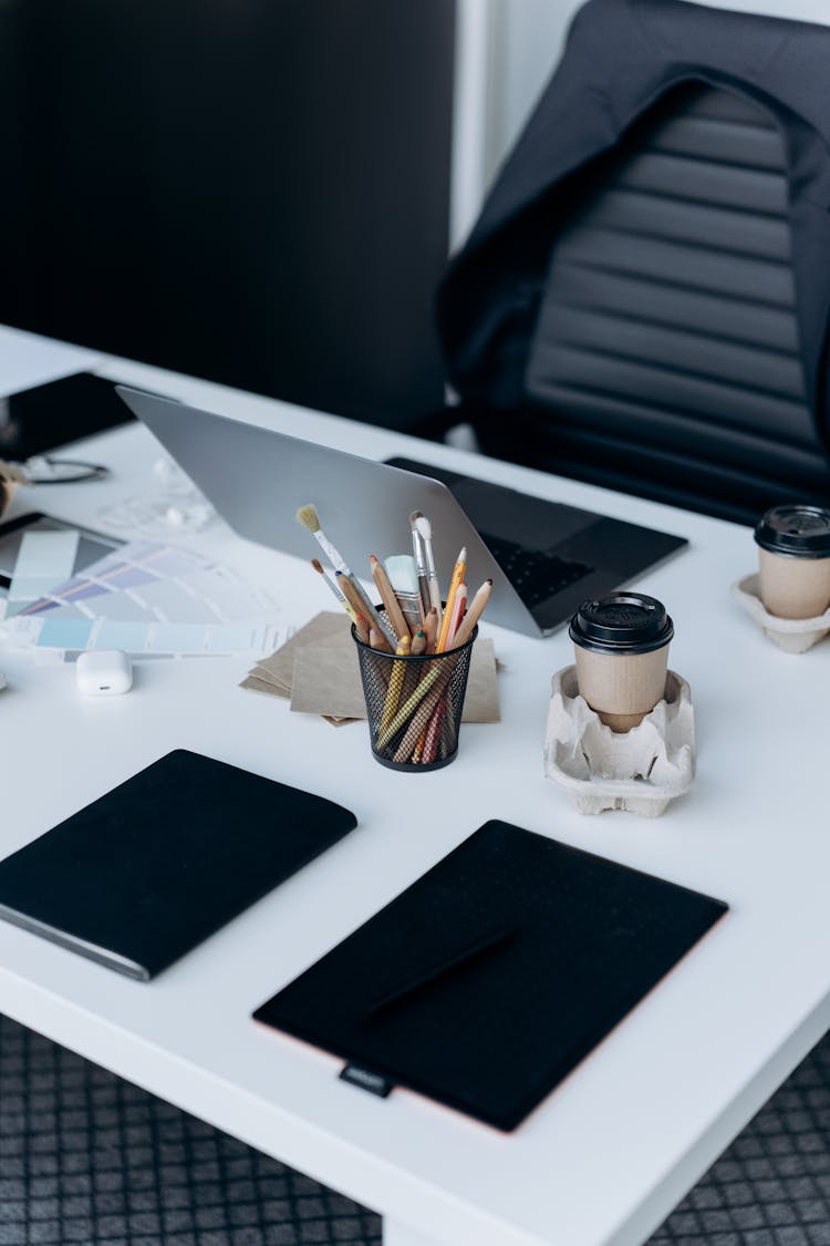 Cups Of Coffee On A Workspace