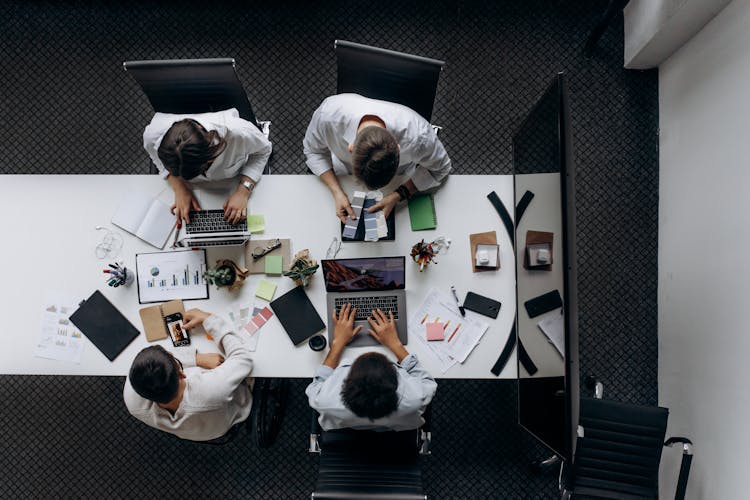 Overhead Shot Of Business People Working