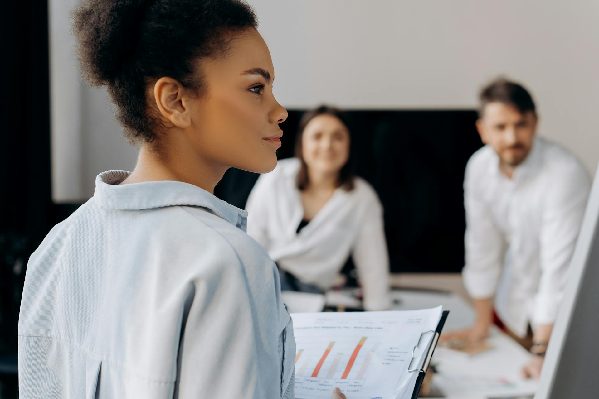 A Group of People Having a Meeting in the Office