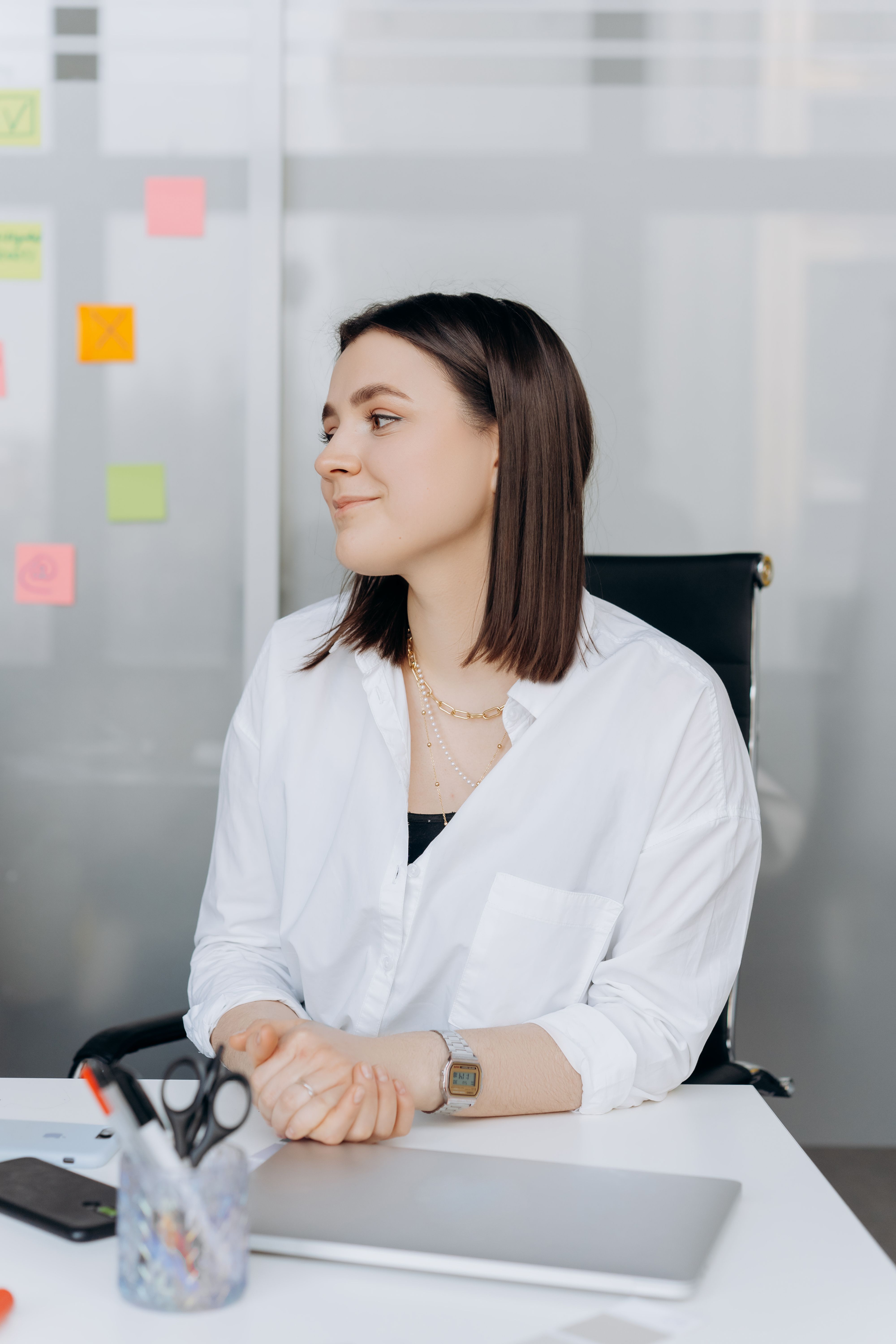 A Woman in White Long Sleeves Sitting in the Office · Free Stock Photo