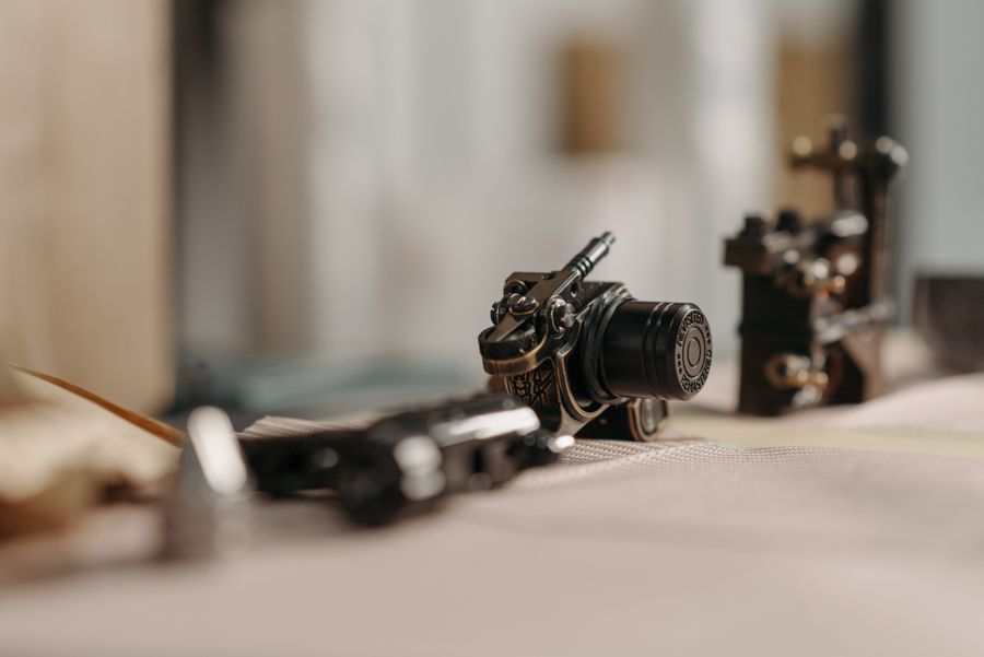 Close-up of a tattoo machine on a worktable