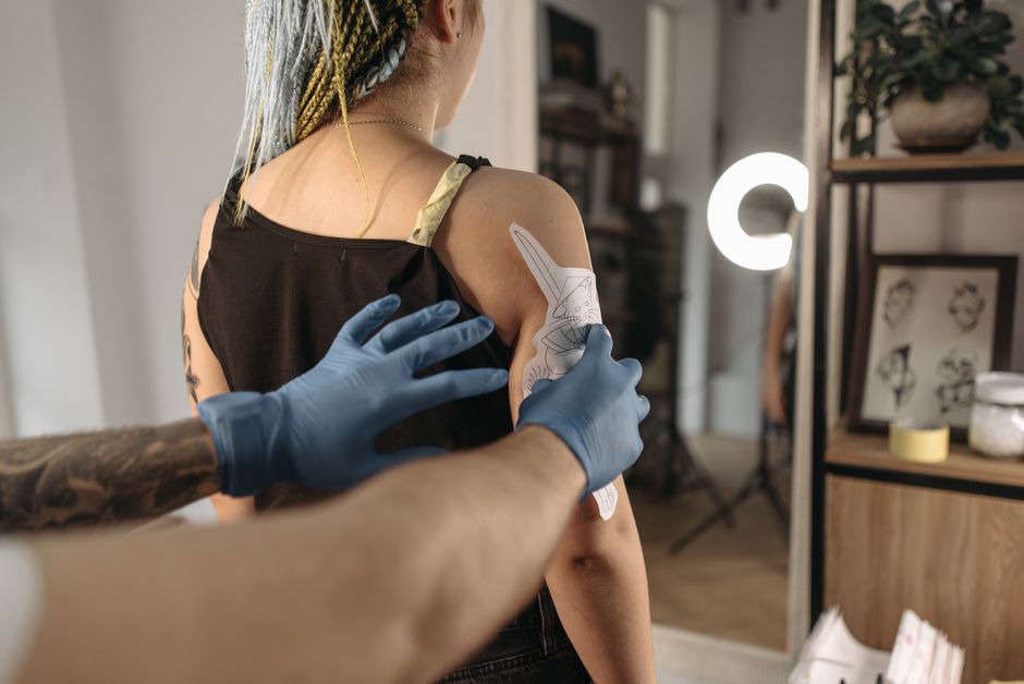 Aspiring Tattoo Artist practicing line work during a debt-free tattoo apprenticeship