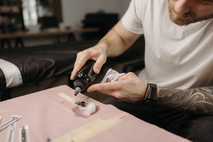 Tattoo artist preparing ink for a session