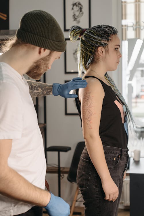 Woman Getting a Tattoo · Free Stock Photo