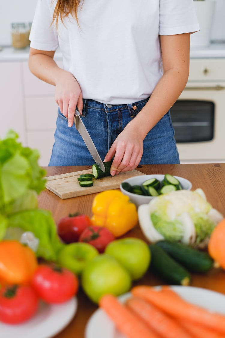 Cutting Cucumber On Board