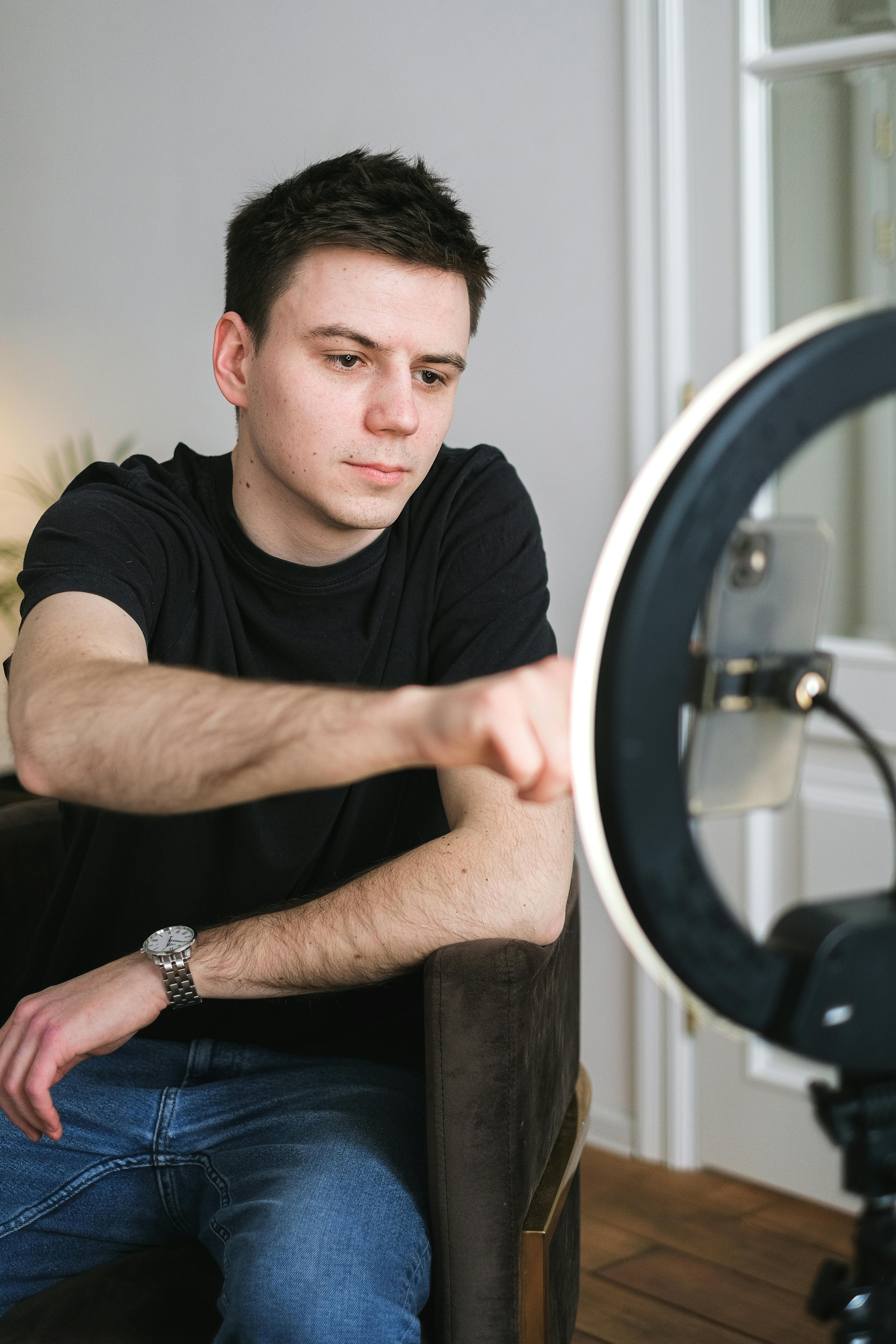 man recording using a phone camera