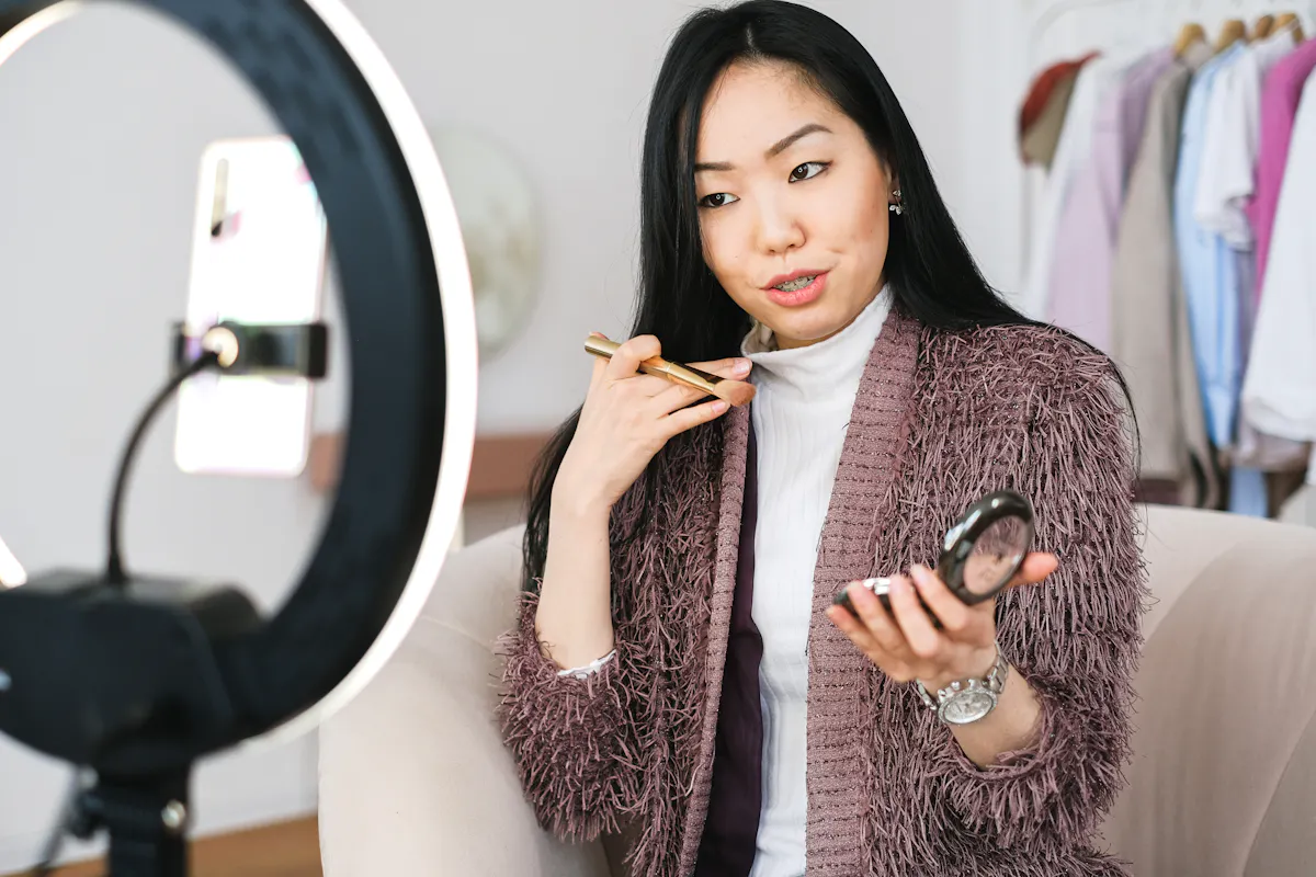 A beauty blogger records a video about makeup and beauty hacks.