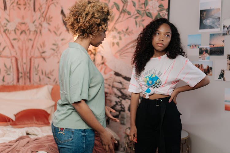 Mother Talking To Bored Daughter