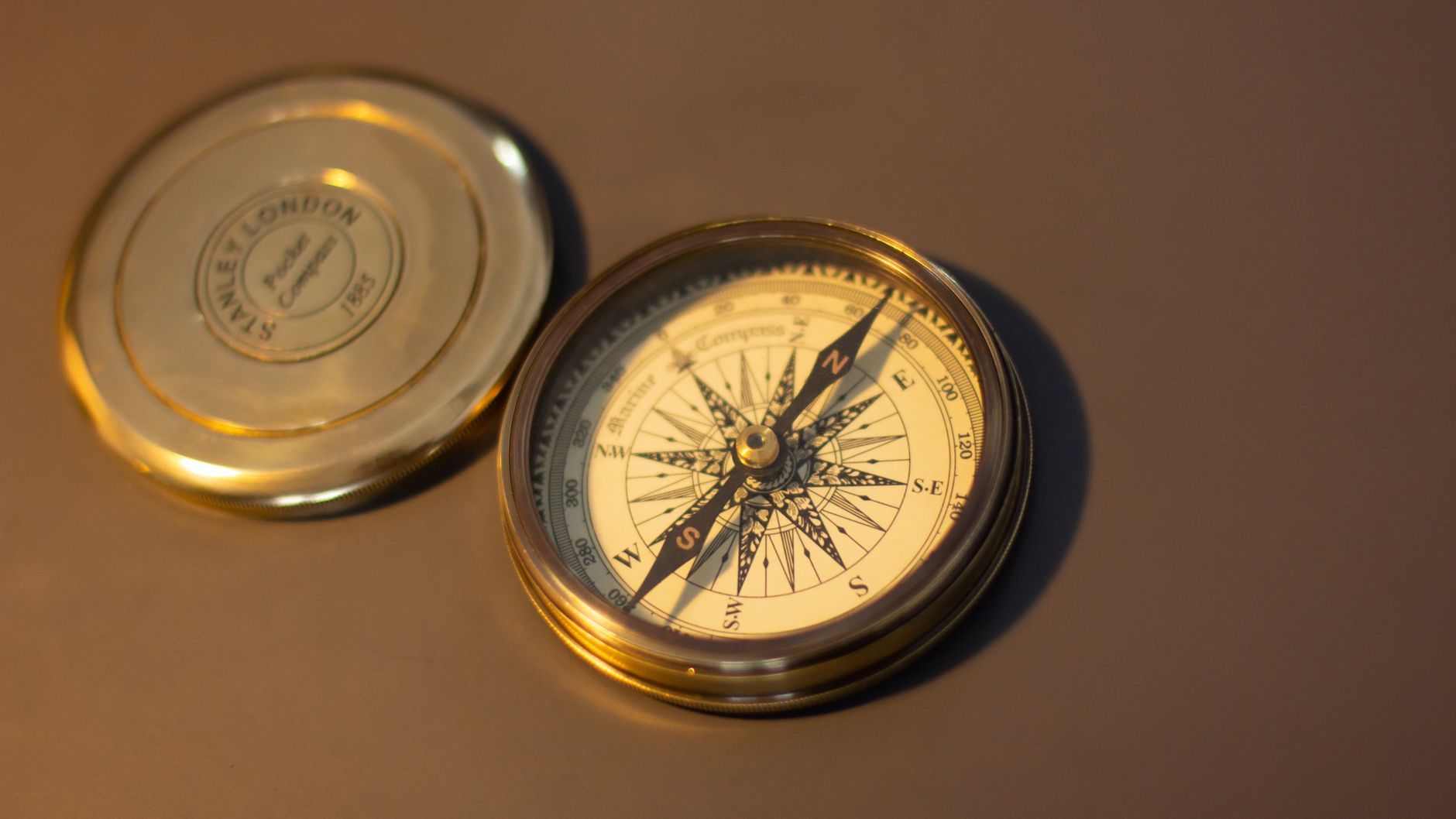 a Football Compass analyst comparing NCAA, NFL, NFHS, and FIFA rule documents beside statistical charts