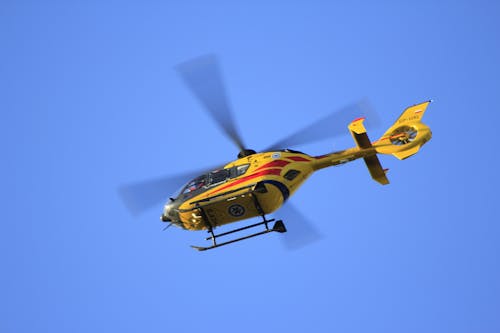 Free Yellow Hellicopter Flying Stock Photo