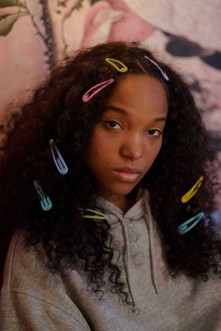 Girl In Gray Shirt Wearing Colorful Hairpins