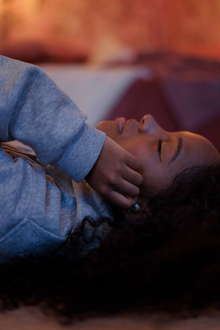 Photograph Of A Girl Listening To Music