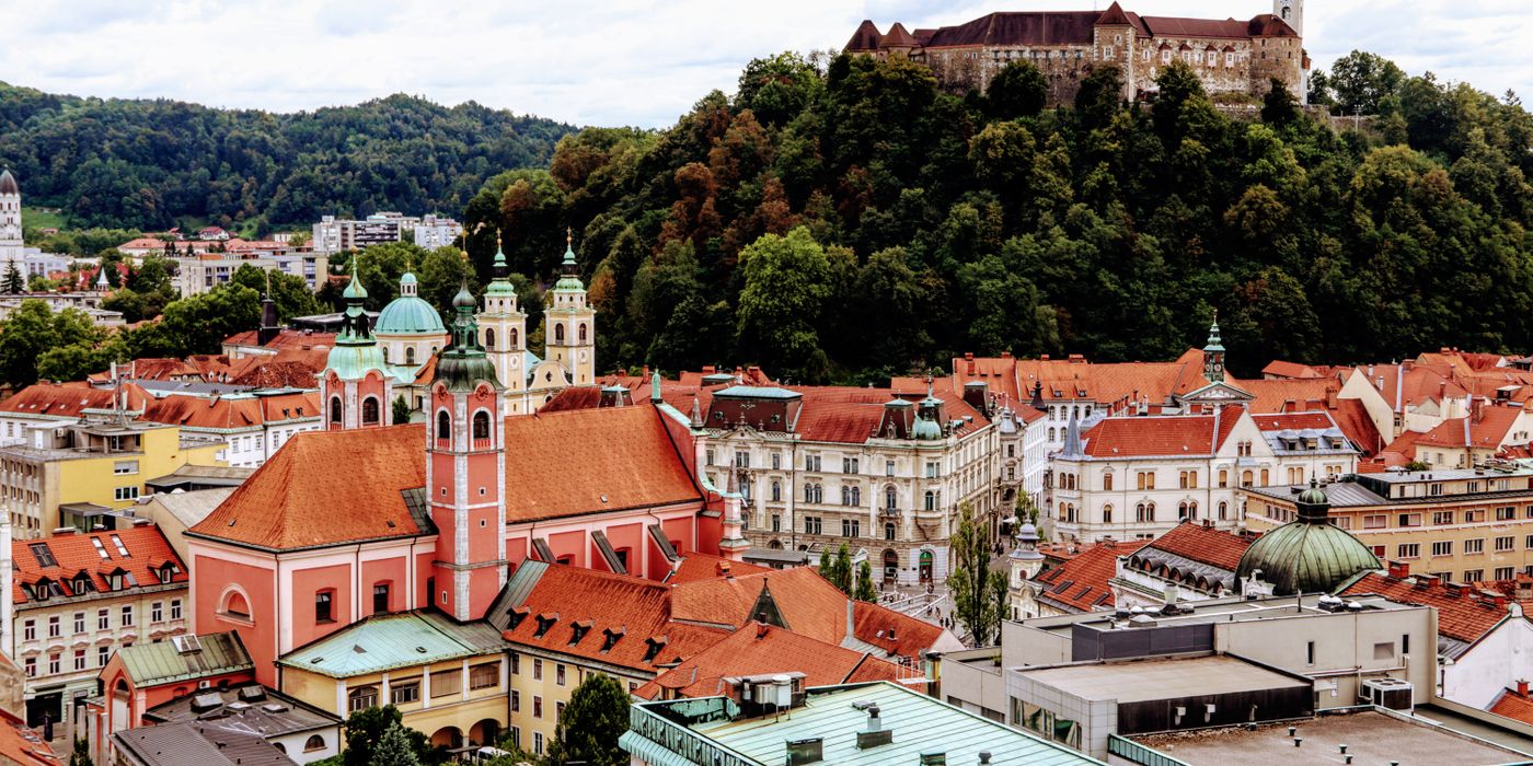 Ljubljanica river through Ljubljana old town with bridges and riverside cafes