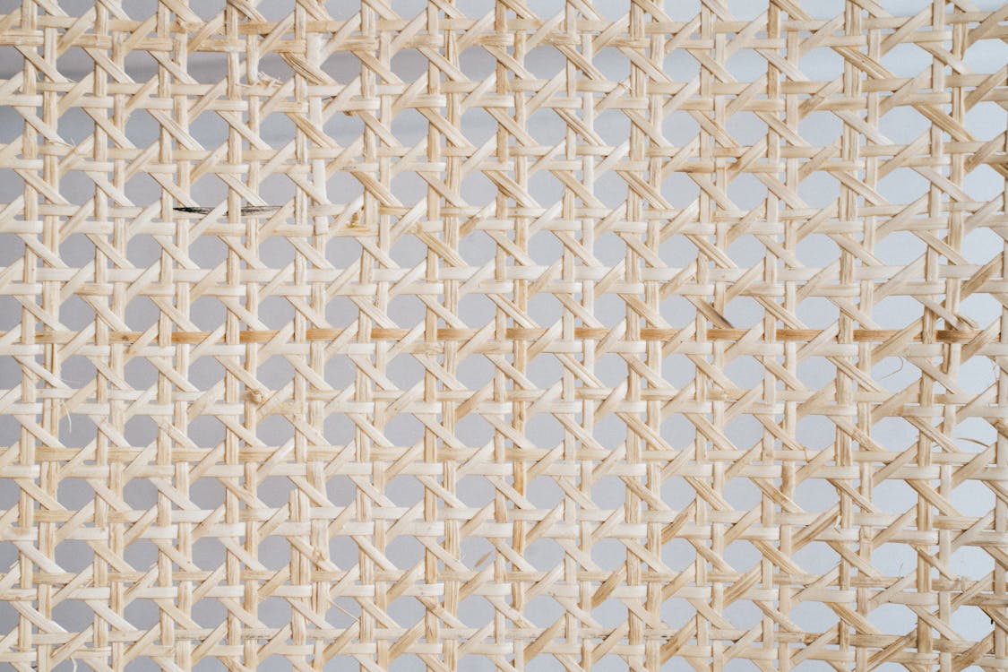Close Up Photo of Natural Rattan Hexagonal Woven Material