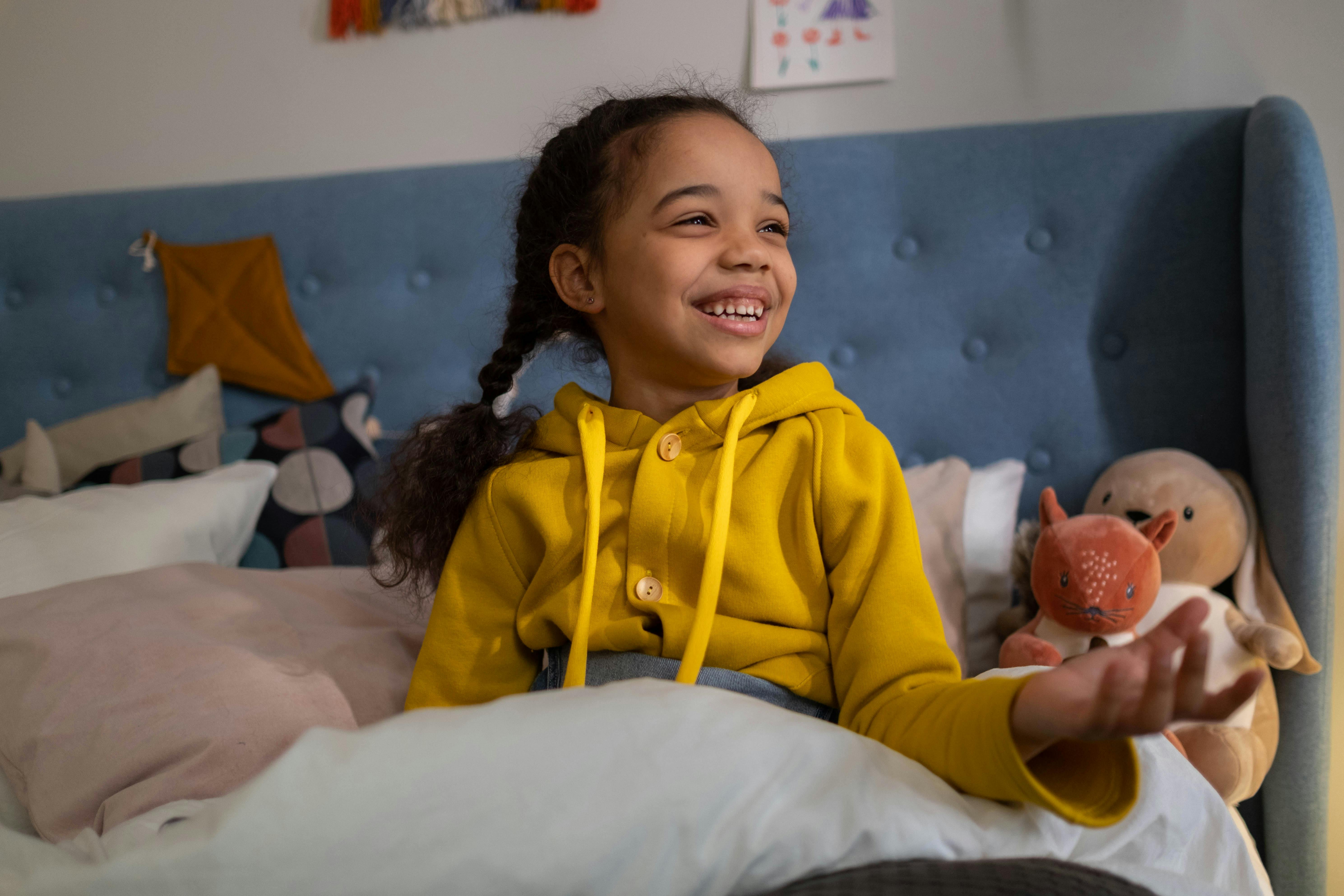 Girl in Yellow Jacket Smiling · Free Stock Photo