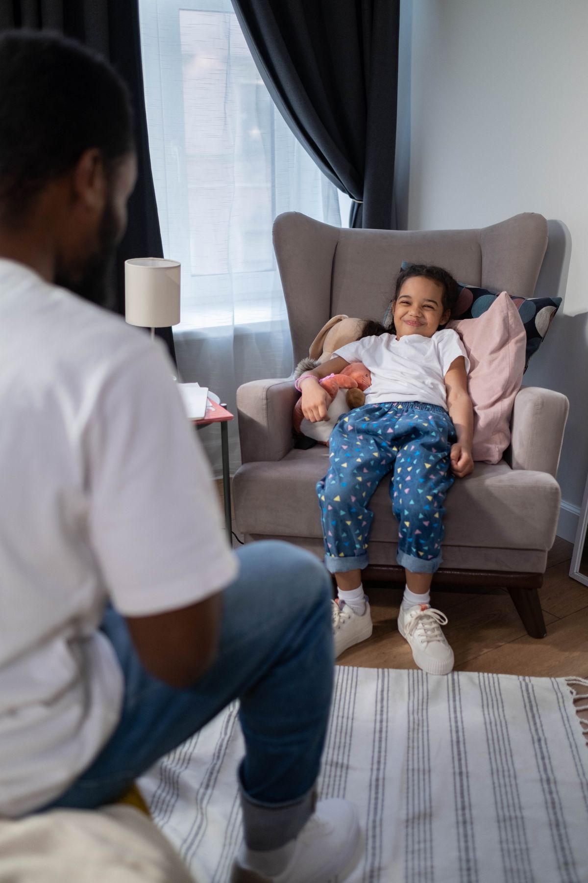 Parent and child sharing a joyful moment at home