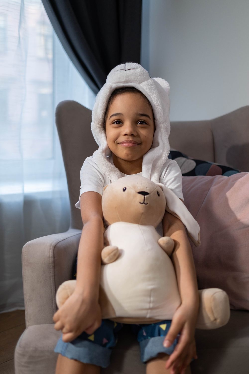 A Girl Holding a Stuffed Toy · Free Stock Photo