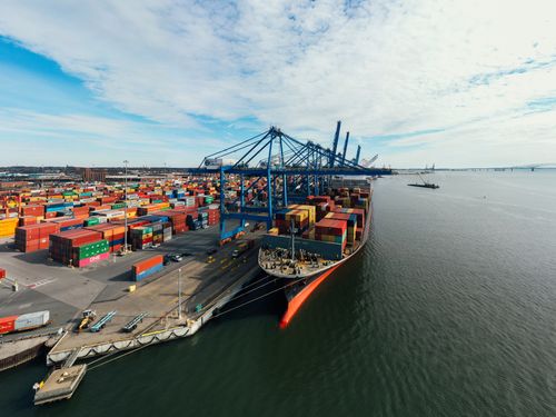 Aerial view of a shipping port with colorful cargo containers