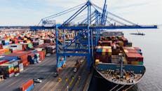 Cargo ship unloading colorful containers in port