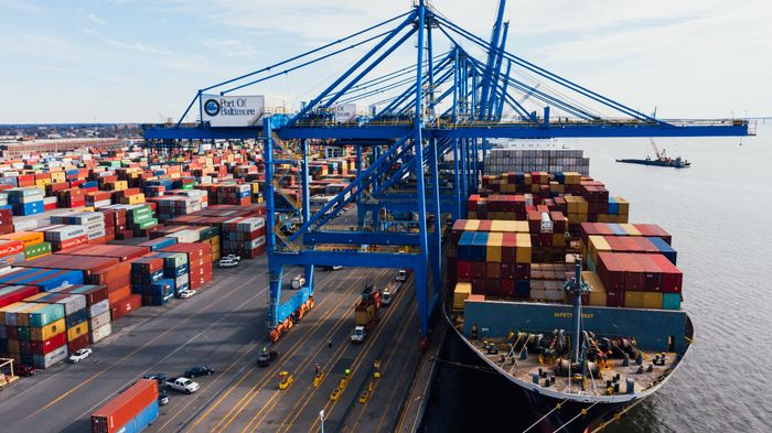 Cargo ship unloading containers in port