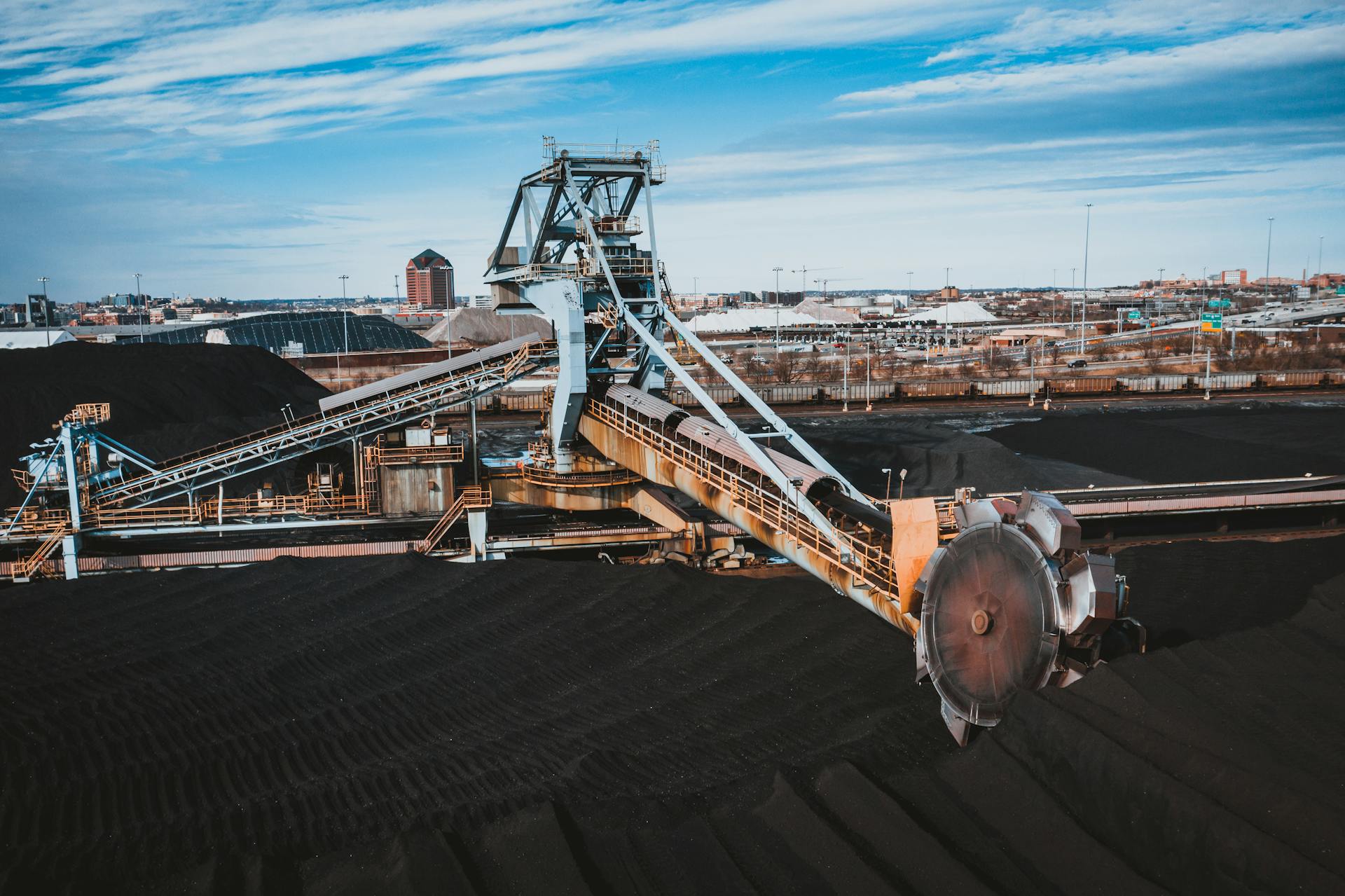 A large industrial coal conveyor system in Baltimore outdoors during the day.