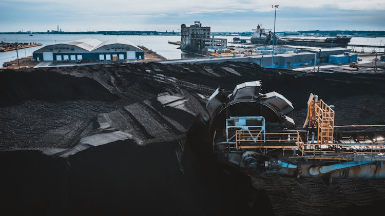 Machine Digging Coal In Industrial Area