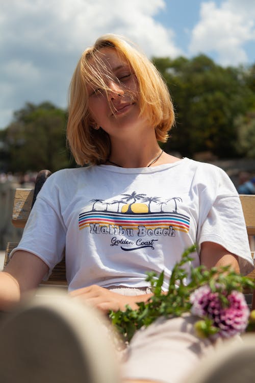 A Portrait of a Young Woman in a Malibu Beach T Shirt