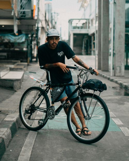 Free Asian man with mountain bike on street in Jakarta, Indonesia Stock Photo