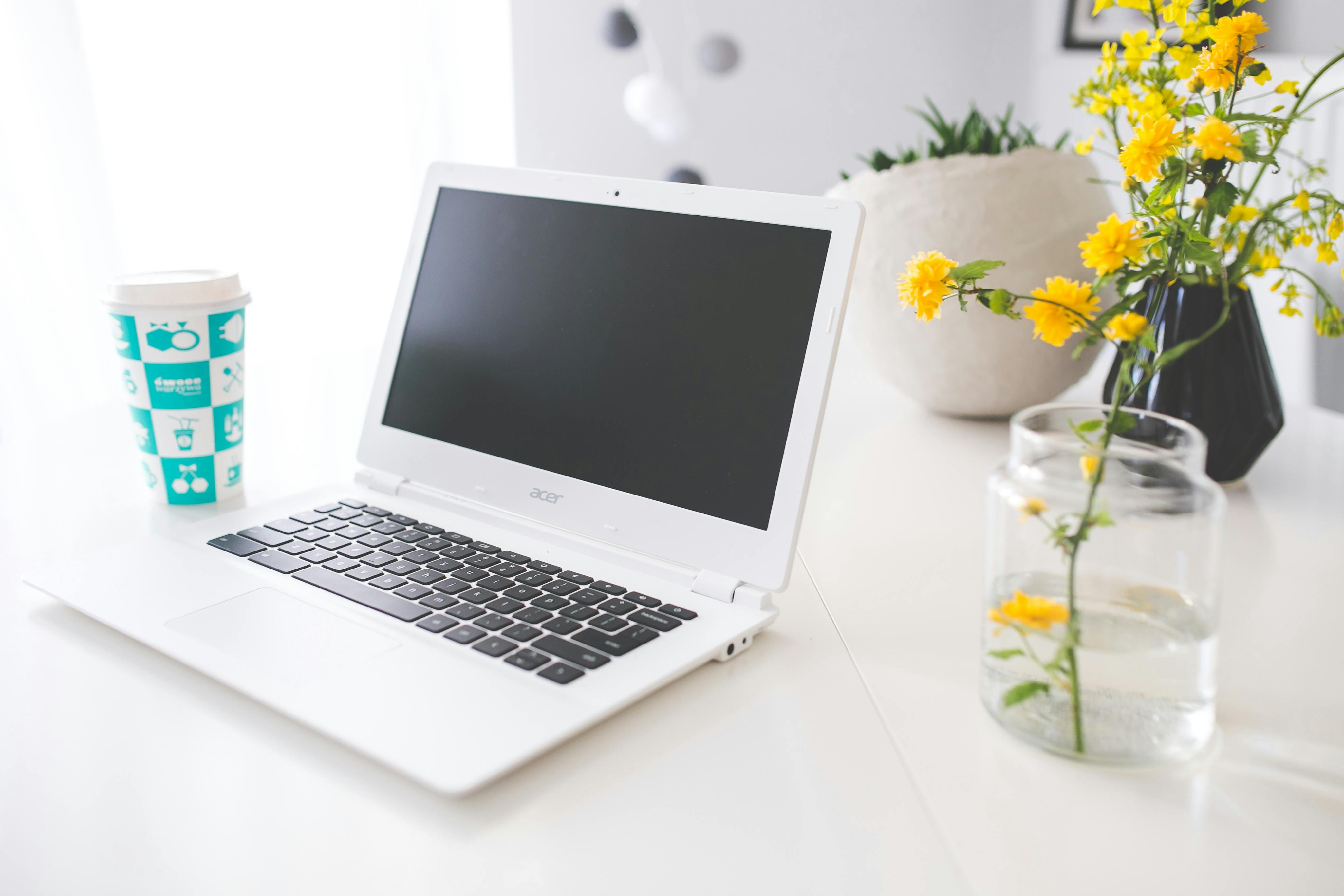 Acer Chromebook On The White Desk Free Stock Photo