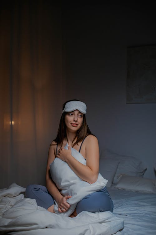 Free A Woman holding the Pillow Stock Photo