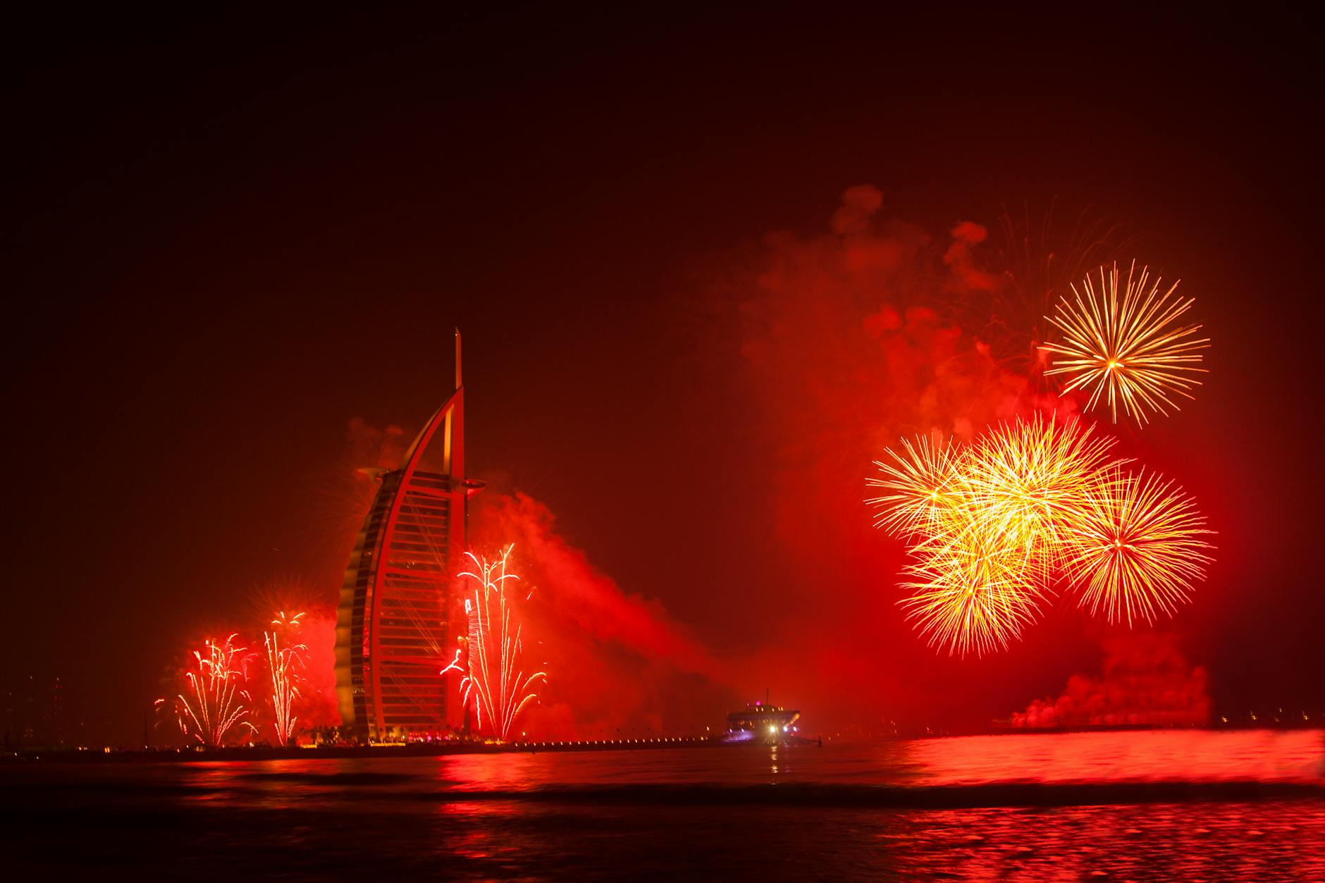 Spectacular fireworks lighting up the night sky at Burj Al Arab in Dubai, United Arab Emirates.