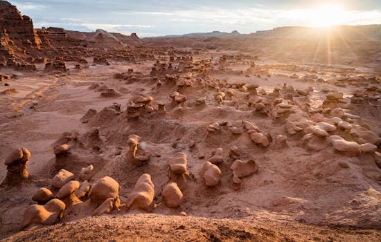 Capture of sunlit rock formations at sunrise in Goblin Valley, Utah.