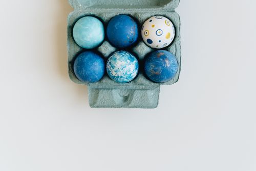 Free Decorative blue Easter eggs in a carton with a minimalist style, perfect for holiday themes. Stock Photo
