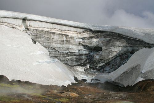 Free Majestic glacier with snow-covered layers in Iceland's rugged terrain. Stock Photo
