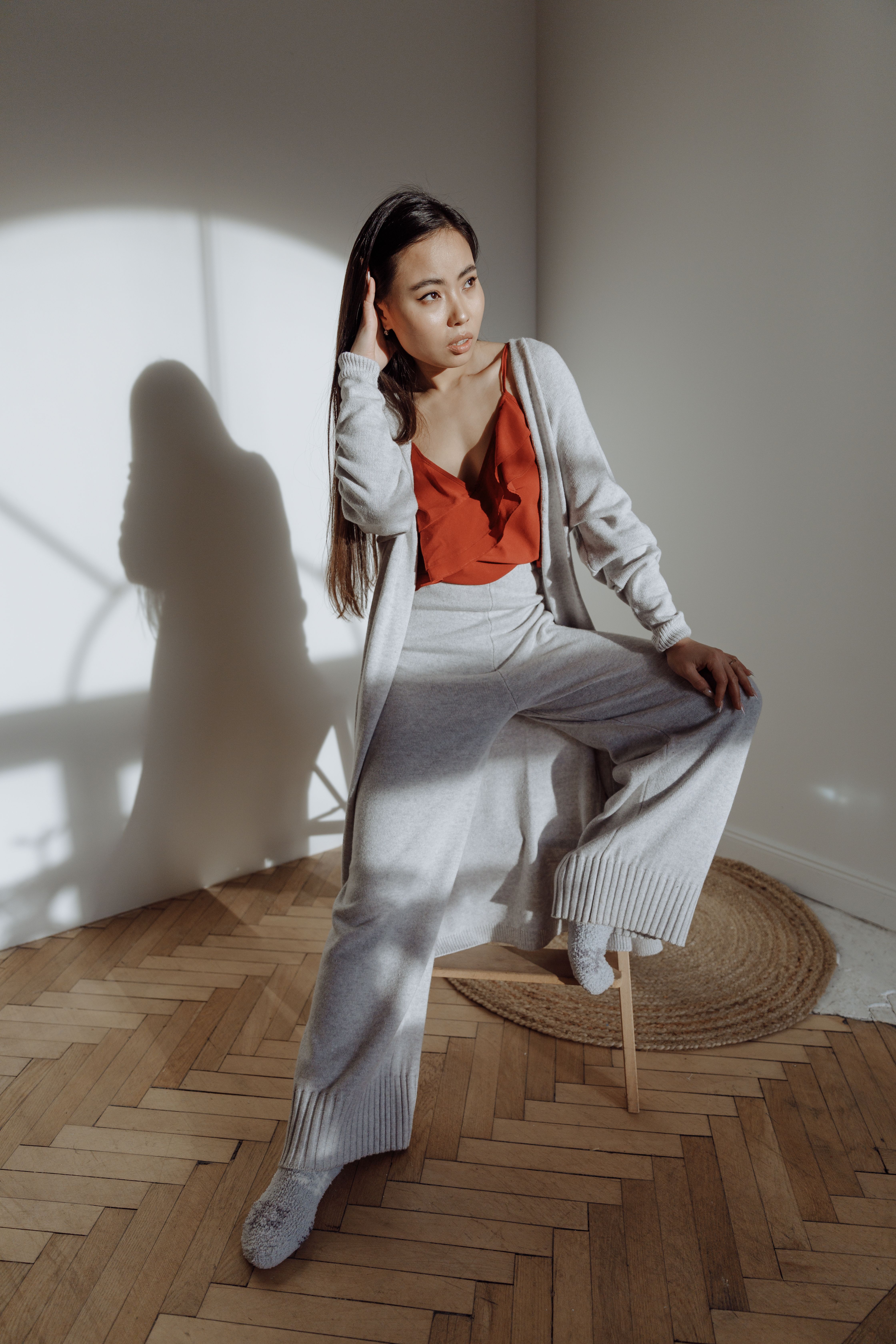 Woman in wide-leg pants with a simple tee and cardigan