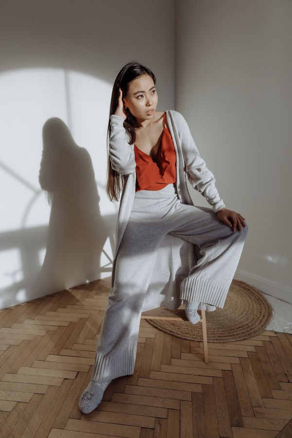Woman in wide-leg pants with a simple tee and cardigan