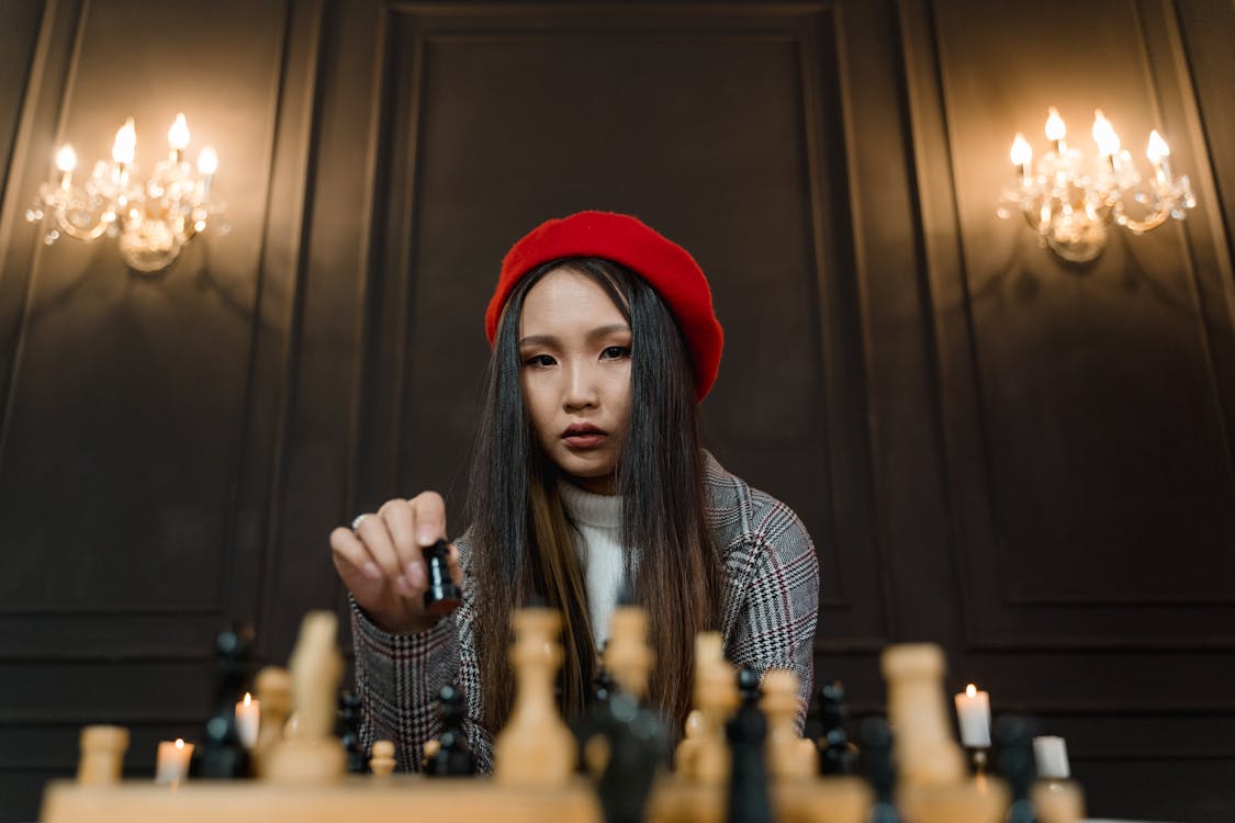 A Woman Playing a Game Of Chess