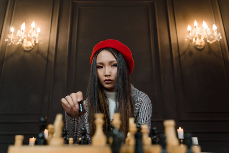 A Woman Playing A Game Of Chess