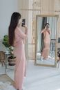 A Woman Taking Selfie in Front of the Mirror